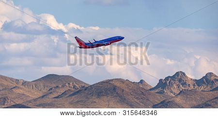 Las Vegas, Nevada, Usa - May 6, 2013: Southwest Airlines Boeing 737 Climbing Over The Mountains On D