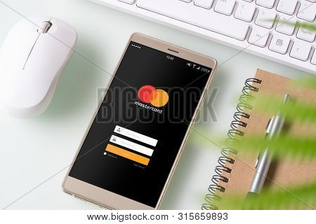 Bangkok, Thailand - August 6, 2019: Mastercard Crypto Wallet Concept. Smartphone With Mastercard Log