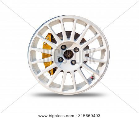 Car Wheels On A White Background Behind A Cutting Machine Separa