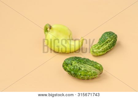 Trendy Ugly Organic Cucumders And Bell Pepper On Light Background, Horizontal Orientation