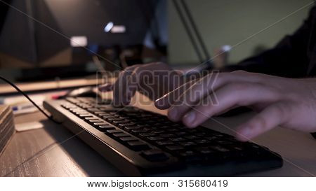 Close Up Of Businessman Hands Typing On Computer Keyboard Lying On A Wooden Table In The Office, Man
