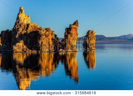 Picturesque Mono lake. Sunset. The columns-remains of bizzare shapes of 