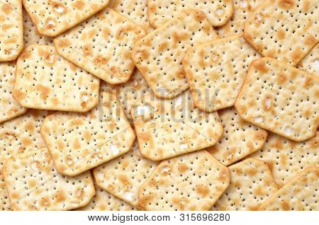 Tuc Original Snack Crackers Lies On Market Table Stacked In Big Pile
