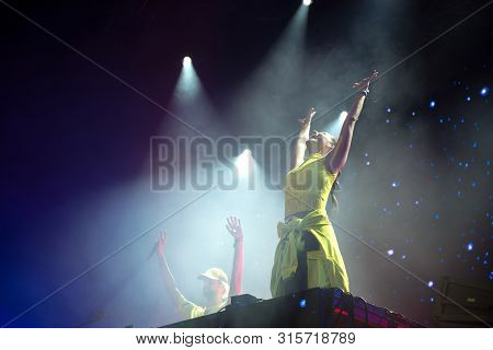 Woman Performer Singing On Stage