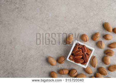 Frame Of Pecan Nuts On Marble Background. Square Bowl Of Nuts In The Corner