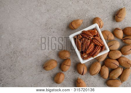 Frame Of Pecan Nuts On Marble Background. Square Bowl Of Nuts In The Corner
