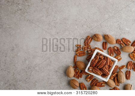 Frame Of Pecan Nuts On Marble Background. Square Bowl Of Nuts In The Corner
