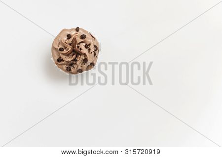Chocolate Cupcake Or Muffin On A White Background, Top View, Place For Text