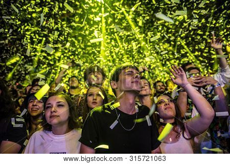 Cheerful Partying Crowd Of People At Music Festival