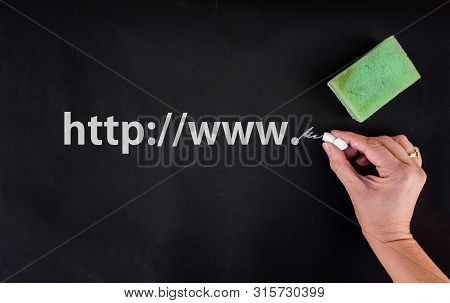 Website Address Or Url Concept. Woman Hand With Chalk And Web Address On Blackboard
