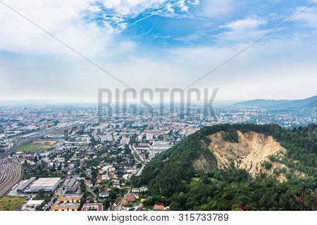 Aerial View Of City Graz From Helicopter Drone With Districts Gösting And Eggenberg And A Quarry On 