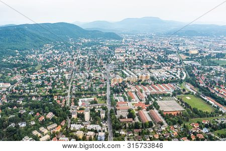 Aerial View Of City Graz From Helicopter Drone With Districts Eggenberg And Wezelsdorf On A Cloudy S