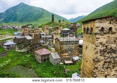 View Of The Ushguli Village At The Foot Of Mt. Shkhara. Picturesque And Gorgeous Scene. Rock Tower T