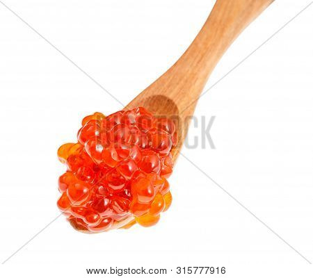Top View Of Little Wooden Spoon With Russian Red Caviar Of Sockeye Salmon Fish Isolated On White Bac