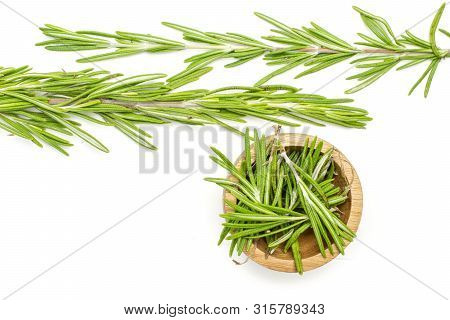 Group Of Two Whole Lot Of Pieces Of Fresh Evergreen Sprig Of Rosemary In A Wooden Bowl Flatlay Isola