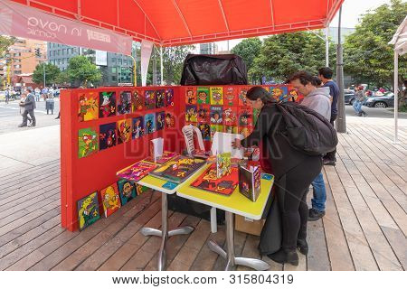 Bogota August 2: Shopping At A Comics Stand In The Sundays Market Of Bogota Set Up In A Peatonal Are