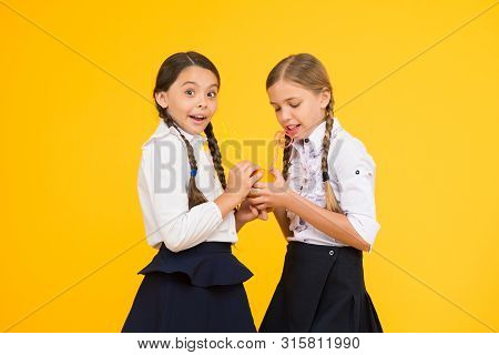 Vitamin C Is Crucial For The Growth. Little Girls Drinking Vitamin Juice From Orange Fruits On Yello