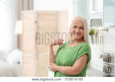 Portrait Of Happy Mature Woman At Home