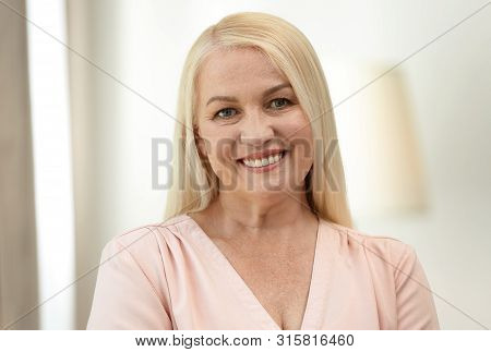 Portrait Of Happy Mature Woman At Home