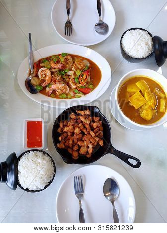 Thai Food Style, Top View Of Spicy Fried Shrimp With Stink Bean, Fried Pork, Sour Soup With Snapper 