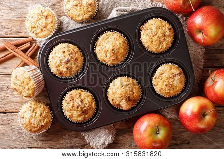 Rustic Style Fresh Apple Muffins With Cinnamon Close-up On The Table. Horizontal Top View