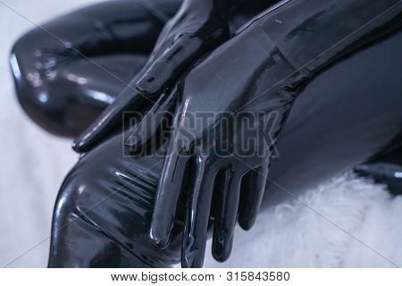 Man In The Latex Rubber Black Catsuit With Gasmask
