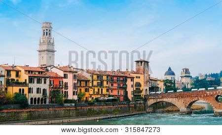 Roman Arch Bridge Over Adige River In Verona. Historical Center Of European City. Romantic Sightseen