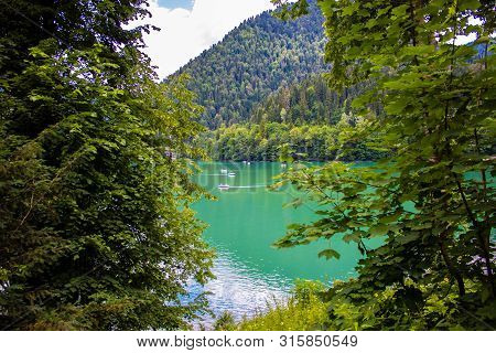 Beautiful Mountain Lake Ritsa. Ritsa Lake In The Mountains Of The Caucasus, In The Northwestern Part
