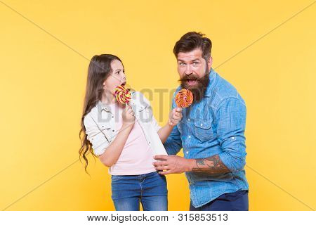 Sharing Sweets With Dearest People. Daughter And Father Eat Sweet Candies. Sweet Dessert. Bearded Hi