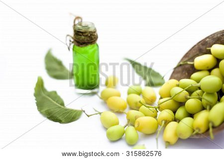 Fresh Green Neem Fruit Of Indian Lilac Fruit In A Clay Bowl Isolated On White Along With Its Concent