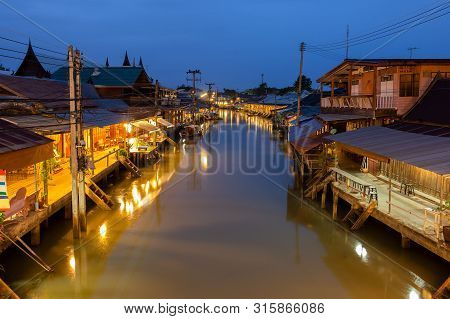 Sunrise At Amphawa Floating Market And Thai Cultural For Tourist Destination.