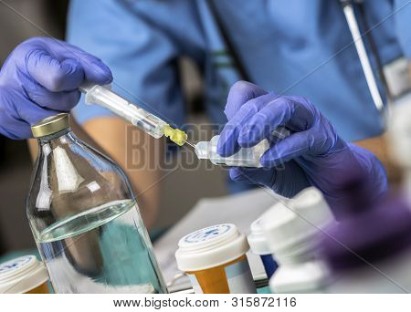 Nurse Preparing Medication For Parenteral Nutrition In A Hospital, Conceptual Image
