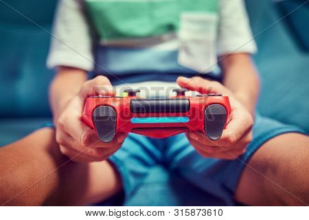 Video Gamer Plays With A Joystick In The Game