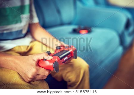 Video Gamer Plays With A Joystick In The Game