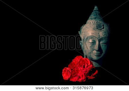 Peace And Love. Traditional Meditating Buddha Head With Red Roses Isolated On Black Background Copys