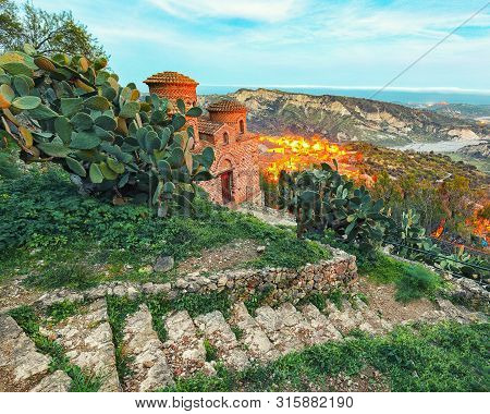 Sunset Over Old Famous Medieval Village Stilo In Calabria. View On Church And City. Southern Italy. 