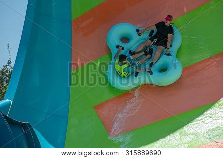 Orlando, Florida. July 29, 2019. People Enjoying Kare Kare Curl Water Attraction At Aquatica 2