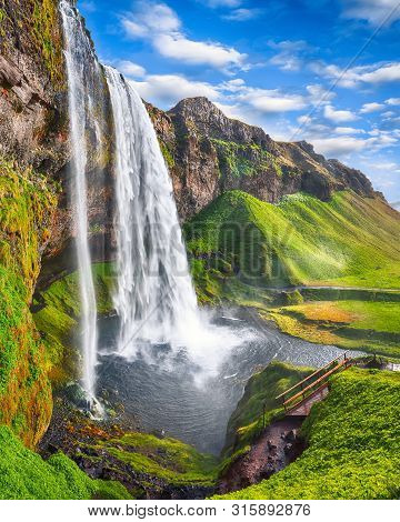 Fantastic Seljalandsfoss Waterfall In Iceland During Sunny Day. Location: Seljalandsfoss Waterfall, 