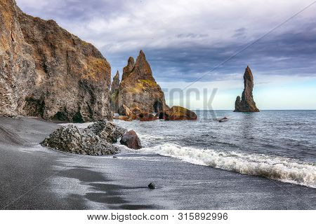 Amazing Landscape With Basalt Rock Formations Troll Toes On Black Beach Reynisfjara Near The Village