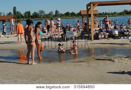 People Bathe In A Salt Lake At A Balneological Resort In Slavyansk Near Donetsk, Ukraine, June 15, 2