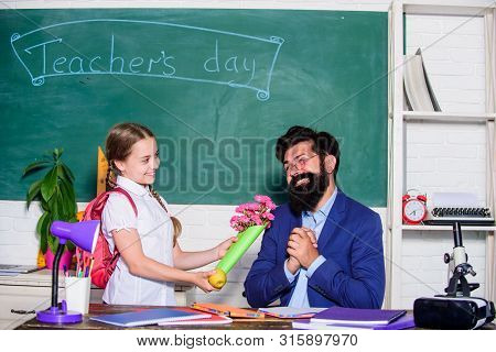 Teachers Day. Daugghter And Father With Flowers. Small School Girl Kid With Flower Bouquet. Knowledg