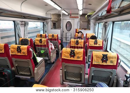 Hualien, Taiwan - November 26, 2018: People Ride A Taiwan Railways (tra) Train In Taiwan. Tra Carrie