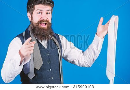 You Should Purchase It. Shop Assistant Pointing Finger And Offering Broad Assortment Of Neckties To 