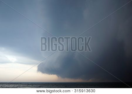 Dangery Thoundstorm With Dark Clouds Coming With The Strong Storm Over Calm The Michigan Lake. Usa, 