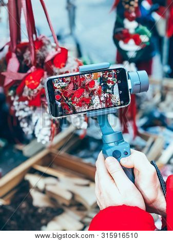 Germany, Nuremberg - December 17, 2018: Close-up Of Man Blogger Hands Shooting Video On Smartphone I