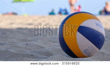 Roses, Girona, Spain- August 1, 2019: Beach Volleyball Ball Mikasa On A Sand. Summer Sport Activity 