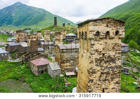 View Of The Ushguli Village At The Foot Of Mt. Shkhara. Picturesque And Gorgeous Scene. Rock Tower T