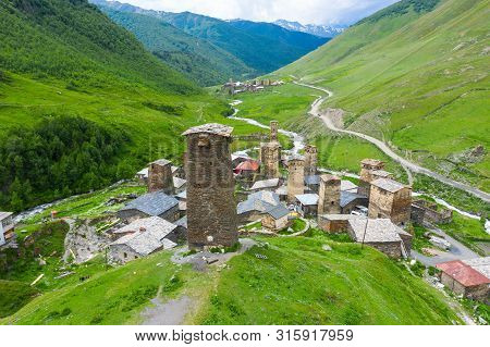 View Of The Ushguli Village At The Foot Of Mt. Shkhara. Picturesque And Gorgeous Scene. Rock Tower T