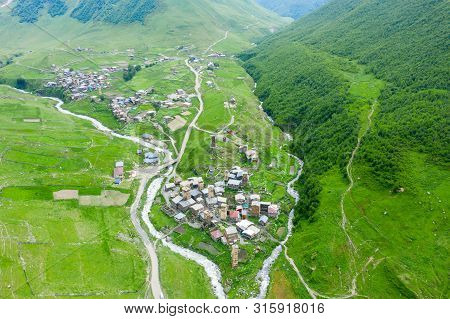 View Of The Ushguli Village At The Foot Of Mt. Shkhara. Picturesque And Gorgeous Scene. Rock Tower T