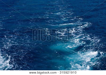 Creative Layout Made Of Clear Sea Watersurface With Kelvou Jet, Bubbles And Waves On Water Surface W